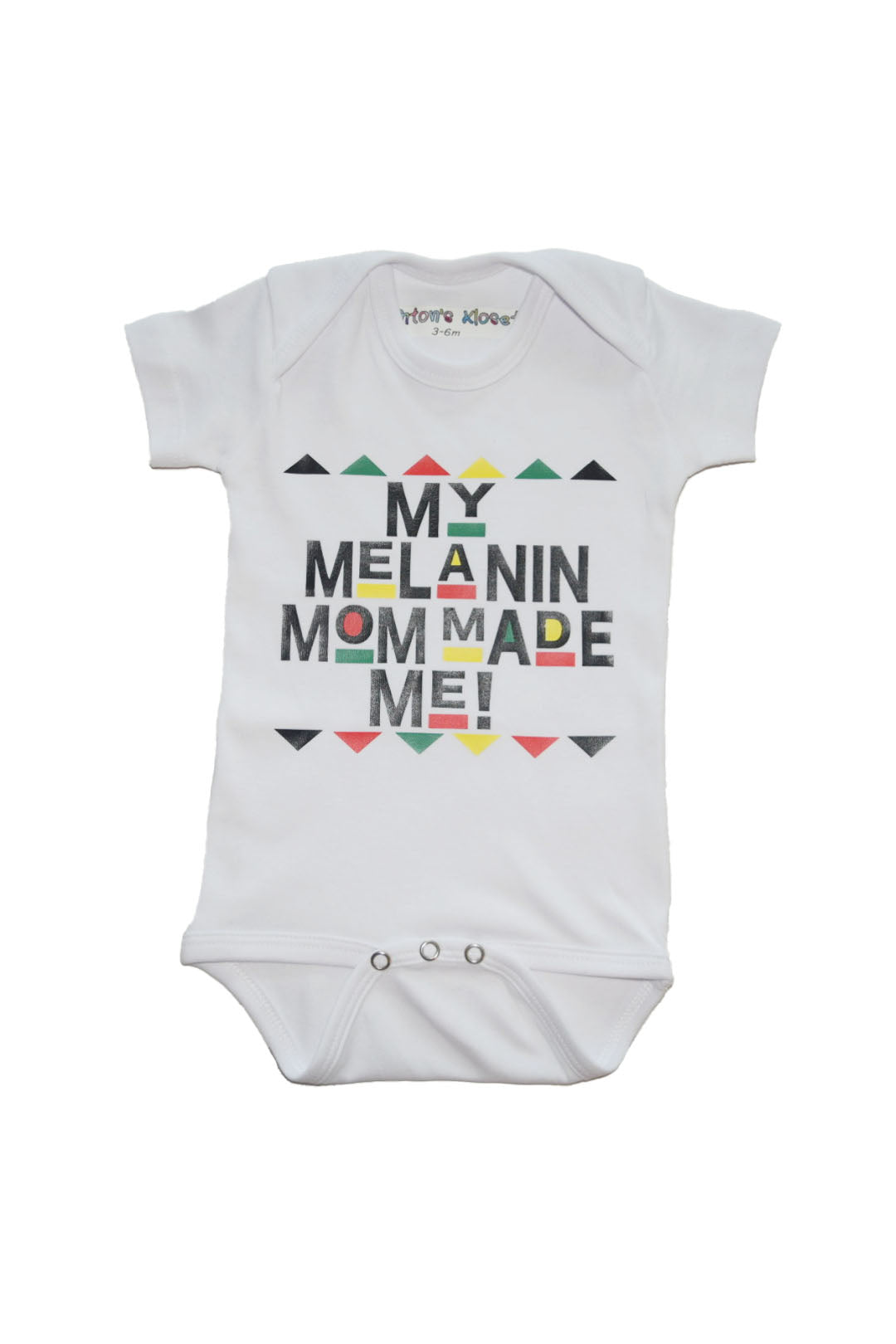 Short sleeved onesie with "My Melanin Mom Made Me" text in soft, organic 100% cotton with snap fasteners 90's style font with tribal colors